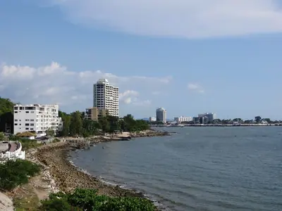 Curved shoreline of Bang Saen with buildings along the coast