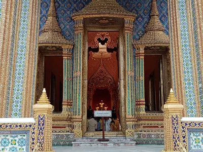 The ornate Royal Pantheon (Prasat Phra Thep Bidon) interior with gold and mosaic decoration