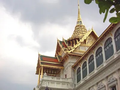 Chakri Maha Prasat Throne Hall at the Grand Palace in Bangkok under a cloudy sky