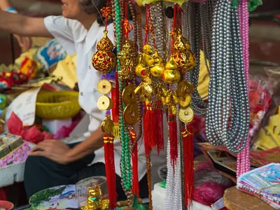 A stall on Yaowarat Road in Bangkok's Chinatown filled with red Chinese New Year decorations (2016)