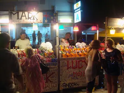 A food and bucket-drinks stall at the Full Moon Party on Koh Phangan