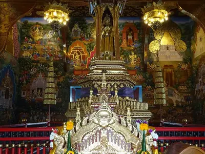 Interior of the City Pillar shrine with a gilded pillar and offerings