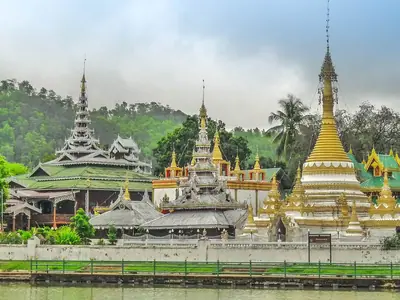 Shan-style temples and golden chedi beside the Chong Kham lake in Mae Hong Son
