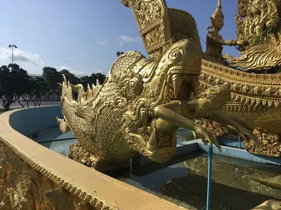 Close-up of the golden carved wax decoration on a replica Candle Festival float in Thung Si Muang park