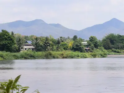Wide Ping River at Tak with hazy mountains behind