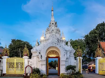 White gateway leading to Wat Phra That Hariphunchai in Lamphun