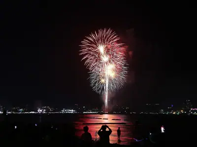 A large red firework with a smaller one above it over Pattaya Bay (28 November 2020)