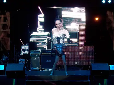 A DJ performs on a lit stage at the Pattaya Music Festival