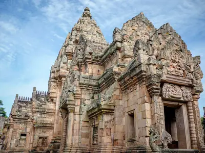 The main sanctuary of Phanom Rung seen from the side against a blue sky