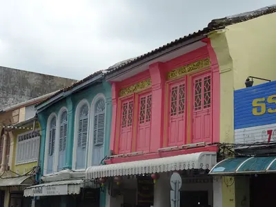Colourful pink, blue and yellow Sino-Portuguese shophouses in Old Phuket Town