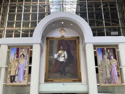 Framed portraits of the Thai royal family above an entrance at Bangkok Railway Station (2022)