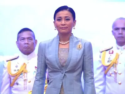 Queen Suthida of Thailand in a light blue suit at a public ceremony (2019)