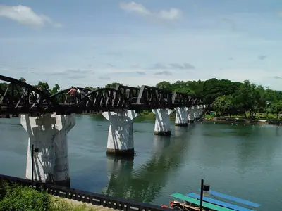 The curved and straight spans of the River Kwai bridge on concrete piers