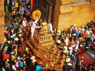 Aerial-style view of a dense, colourful Songkran crowd at the Chiang Mai city wall