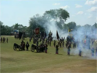 Costumed war-elephant reenactment with smoke across the field at the Surin Elephant Show (2006)