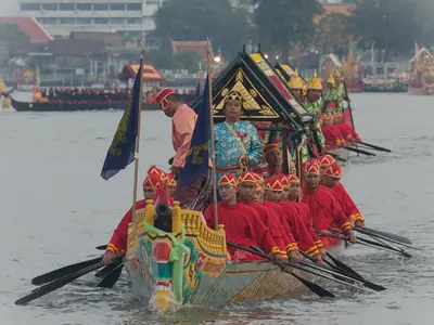 Royal Barge with oarsmen in red uniforms on the Chao Phraya River in Bangkok during the Royal Boating Ceremony (2012)