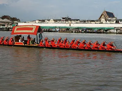 The Thong Khwan Fa royal barge with red-clad rowers on the Chao Phraya River