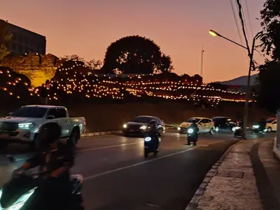 Chiang Mai's old-city wall decorated with lights on the eve of the first day of Yi Peng