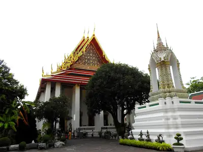 Temple hall with a white chedi in the gardens, Wat Pho