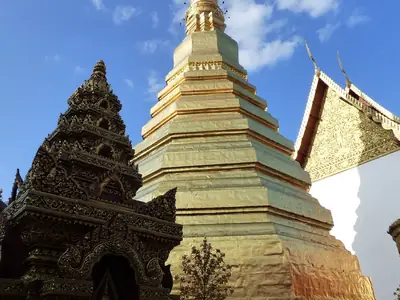 Chedi beside a temple building, Wat Phra That Cho Hae (Phrae)