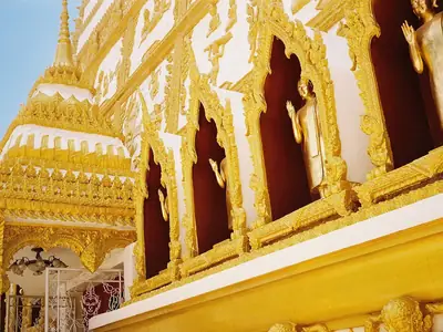 Gilded niches at the stupa base, Wat Phra That Nong Bua (Ubon Ratchathani)