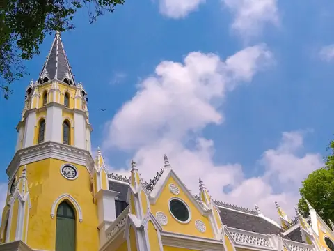 Gothic-style yellow church-like hall and tower, Wat Niwet Thammaprawat (Bang Pa-In)